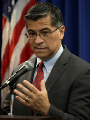 Xavier Becerra Delivering A Speech Portrait Wallpaper