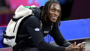 Xavier Worthy Smiling With Backpack Wallpaper