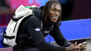 Xavier Worthy Smiling With Backpack Wallpaper