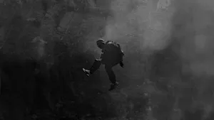 Xxxtentacion Listens To Music With His Laptop Wallpaper