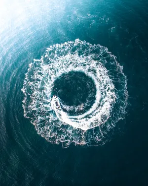 Yacht Above Deep Ocean Blue Waters Wallpaper