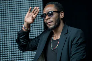 Yasiin Bey Embracing His Musical Legacy Wallpaper