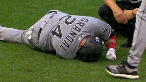 Yasmani Grandal Lying Down On Field Wallpaper