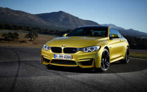 Yellow B M W Coupe On Road Wallpaper