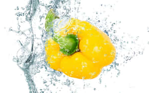 Yellow Bell Pepper On A Wooden Surface Wallpaper