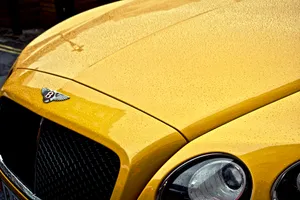 Yellow Bentley Under The Rain Wallpaper