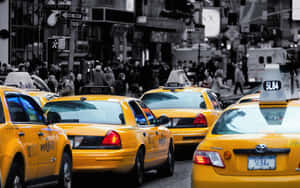 Yellow Cab Parked In A Colorful Urban Environment Wallpaper