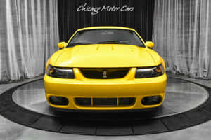 Yellow Ford Mustang S V T Cobra Showroom Wallpaper