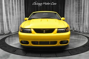 Yellow Ford Mustang S V T Cobra Showroom Wallpaper