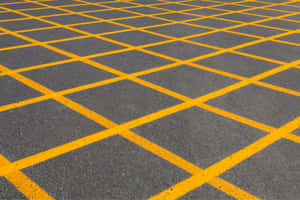 Yellow Painted Parking Lot Lines Wallpaper