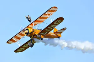 Yellow Small Plane With Smoke Wallpaper