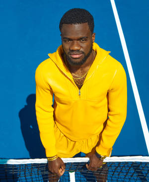 Yellow Sports Attire Frances Tiafoe Wallpaper