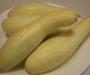 Yellow Squash Fruits On A White Plate Wallpaper