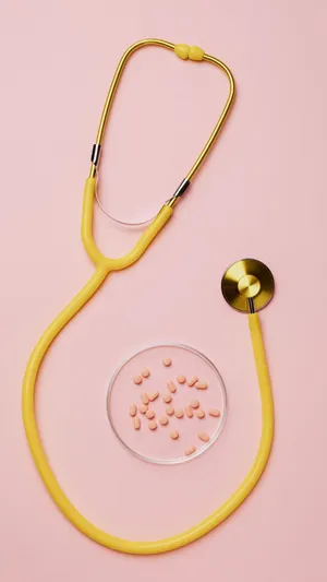 Yellow Stethoscope Pink Pills Pink Background Wallpaper