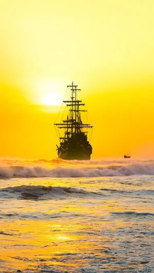 Yellow Sunset At The Beach Wallpaper