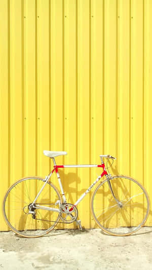 Yellow Wall White Bike Summer Aesthetic.jpg Wallpaper