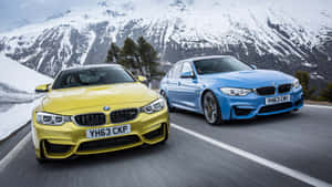 Yellowand Blue Coupes Mountain Drive Wallpaper