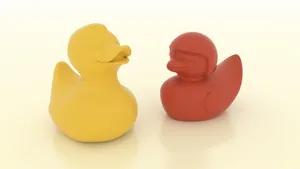 Yellowand Red Rubber Ducks Together.jpg Wallpaper
