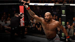 Yoel Romero Celebrating Victory Against Luke Rockhold At Ufc 221 Wallpaper