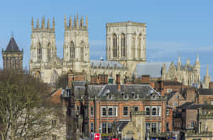 York Minster Cathedral Behind Buildings Wallpaper