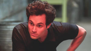 You American Actor Penn Badgley As Joe Goldberg Wallpaper