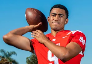 Young Football Quarterback Pose Wallpaper