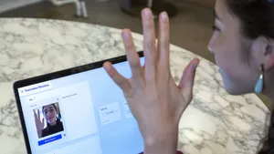 Young Girl Interacting With Teachable Machine Wallpaper