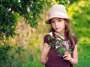 Young Girl Summer Hat Outdoors.jpg Wallpaper