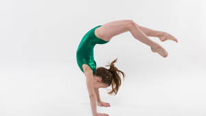 Young Gymnast Bridge Tumbling Stunt Wallpaper