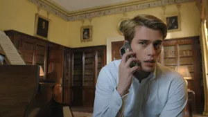 Young Man On Phone In Elegant Room Wallpaper