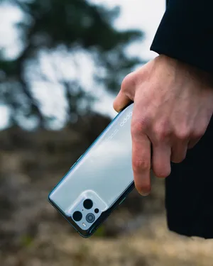 Young Man With Oppo Device Wallpaper