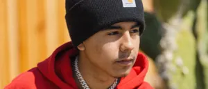 Young Manin Beanieand Red Hoodie Wallpaper