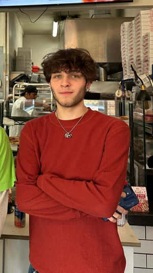 Young Manin Red Sweaterat Pizzeria Wallpaper