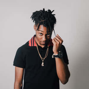 Young Manwith Dreadlocksand Gold Chain Wallpaper