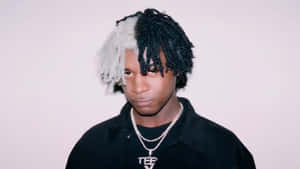 Young Manwith Two Tone Hairstyle Wallpaper