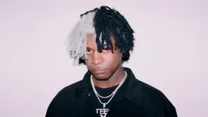 Young Manwith Two Tone Hairstyle Wallpaper