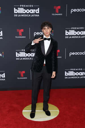 Young Musician Red Carpet Pose Wallpaper