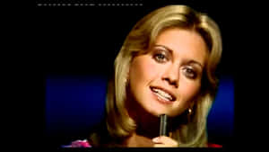 Young Olivia Newton John Singing Wallpaper