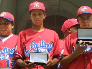 Young Players In Action At A Little League Baseball Game Wallpaper