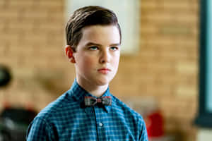 Young Sheldon Contemplative Expression Wallpaper