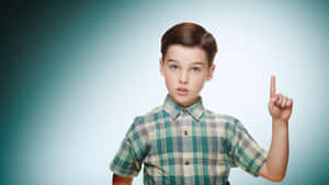 Young Sheldon Raising Hand Wallpaper