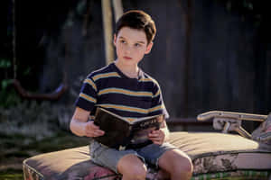 Young Sheldon Reading O E D Wallpaper