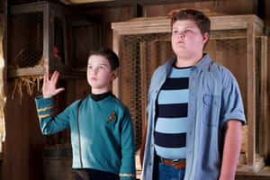 Young Sheldon Star Trek Uniformand Friend Wallpaper