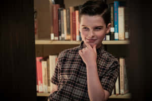 Young Sheldon Thinking Pose Wallpaper