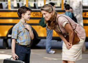 Young Sheldonand Mary Cooper School Bus Scene Wallpaper