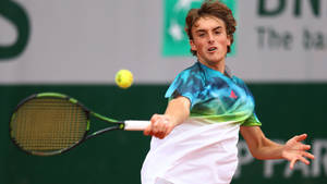 Young Stefanos Tsitsipas Perfecting His Tennis Craft Wallpaper