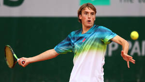 Young Stefanos Tsitsipas With Short Hair Wallpaper