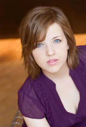 Young Woman Portraitin Purple Top Wallpaper