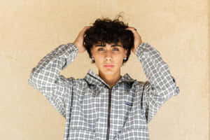 Youthful Curly Haired Individual Wallpaper