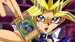 Yugi Muto Posing Heroically With His Favorite Duel Monsters Cards Wallpaper